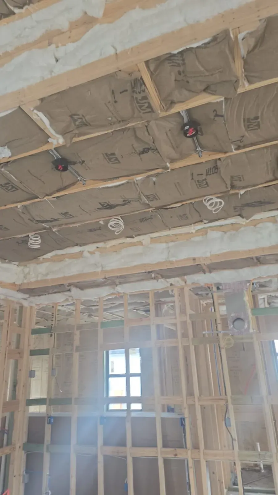 Framing and insulation exposed during a remodel in Lehigh Acres