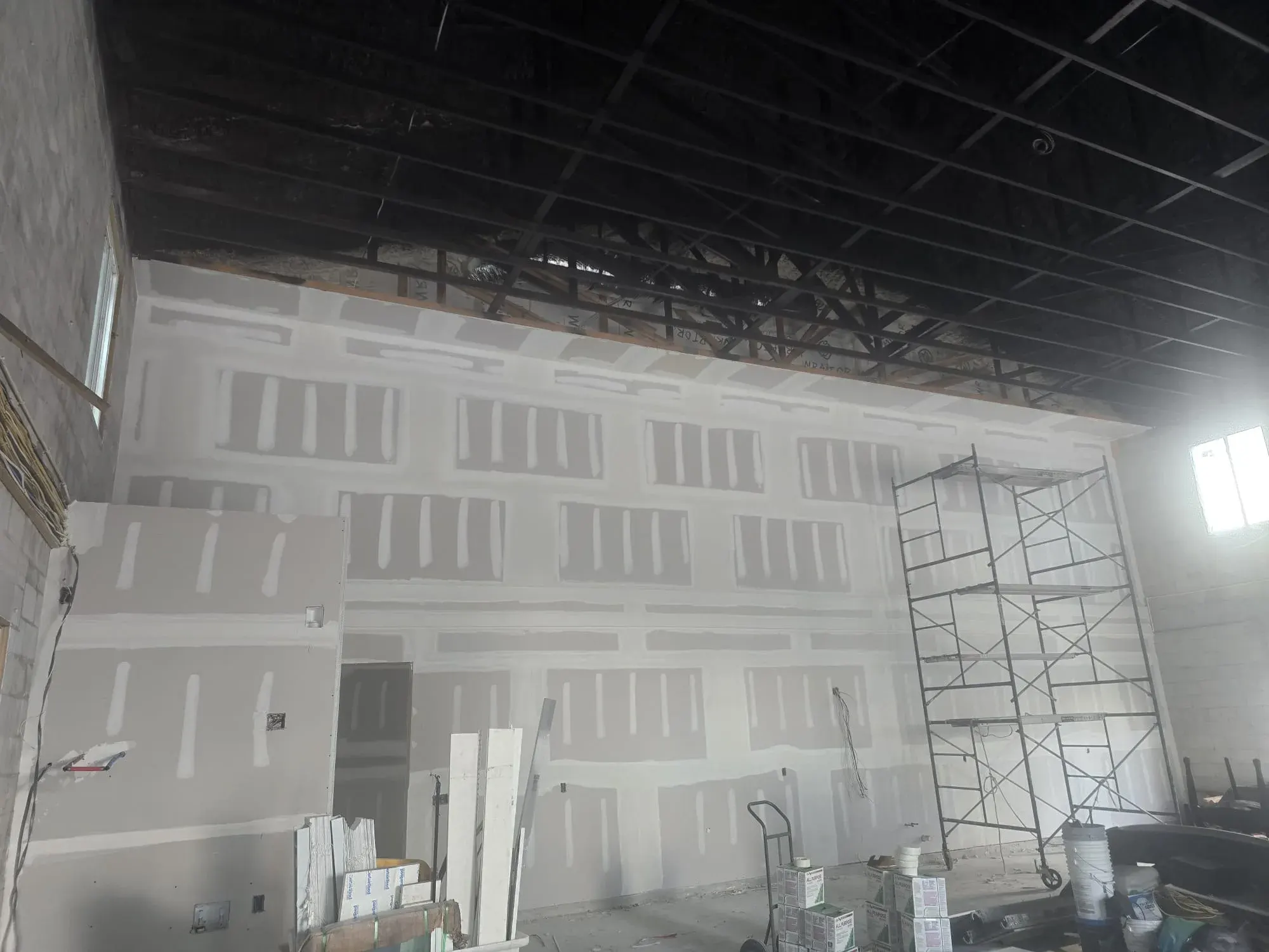 Taped and mudded drywall wall during finishing, Lehigh Acres drywall contractor
